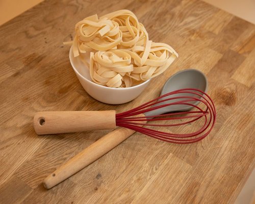 Preparing a simple home meal on a wooden table